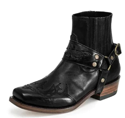 Black leather boot with strap and decorative elements on a white background