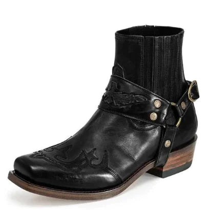 Black leather boot with strap and buckle on a white background