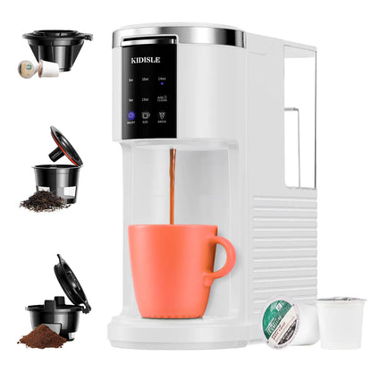 White coffee machine with an orange mug, surrounded by K-cups and coffee grounds on a white background