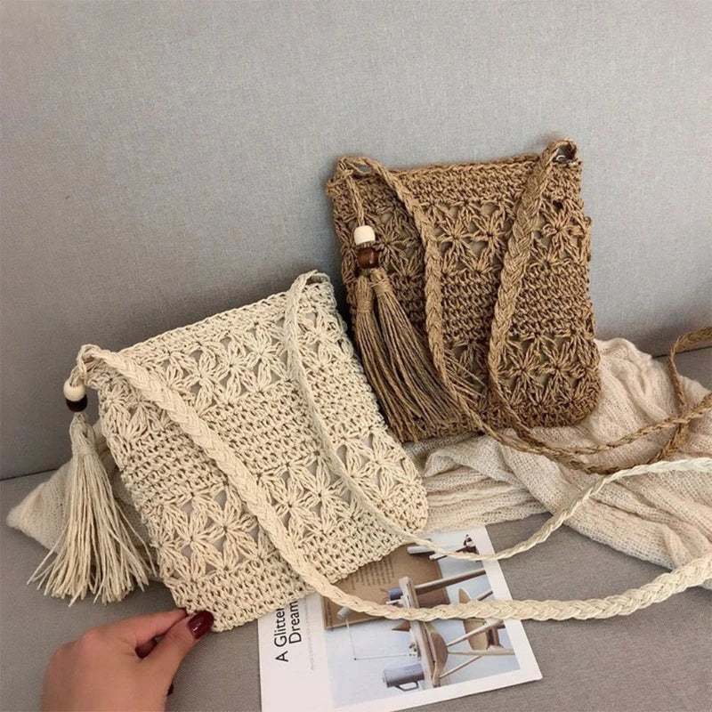 Two crocheted bags, one beige and one brown, on a gray surface with a magazine underneath.